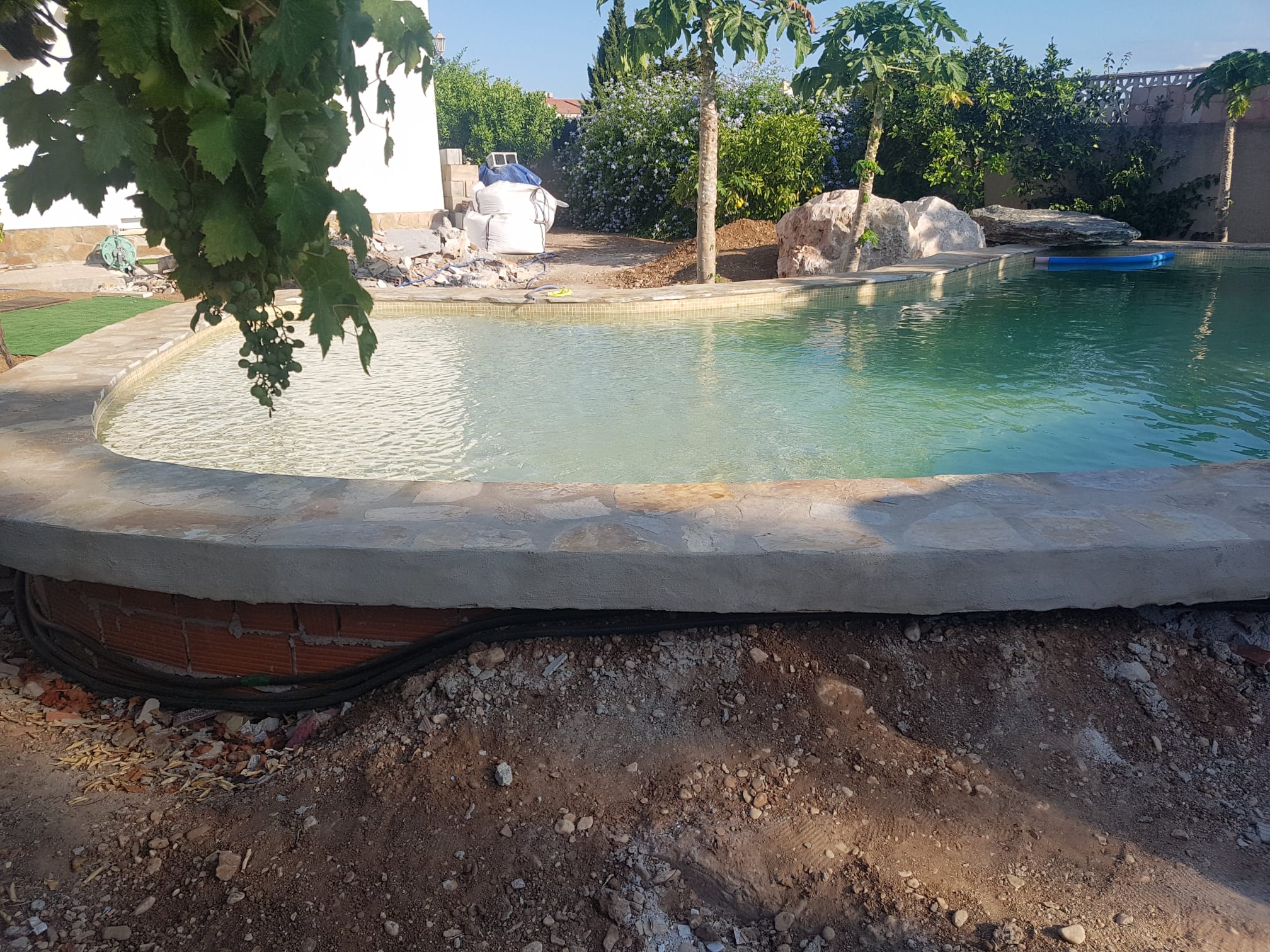 Beach entry pool construction