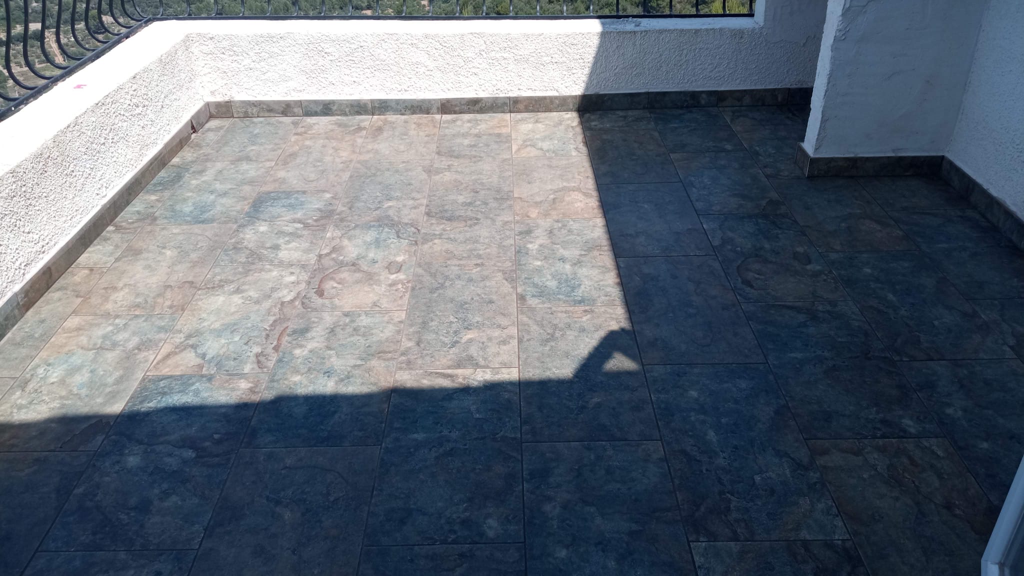 Completed balcony tiling with mountain view