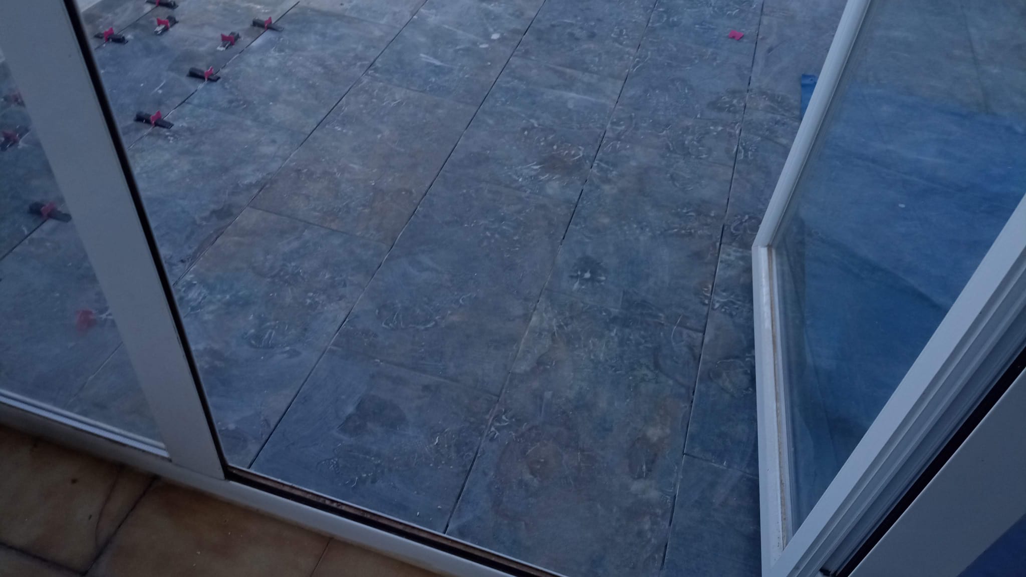 Tile installation with leveling spacers